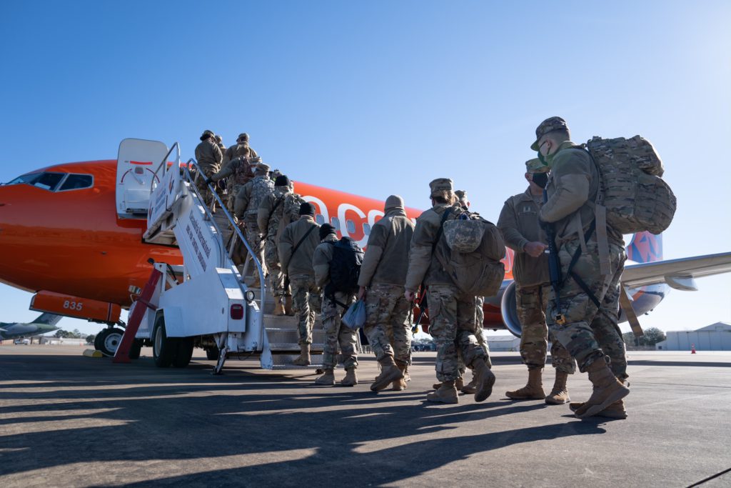 Louisiana National Guard soldiers and airmen from throughout the state prep their gear and board planes in order to assist the District of Columbia National Guard to ensure a safe and secure presidential inauguration at the Alexandria Airport in Alexandria, Louisiana, Jan. 16, 2021. The National Guard Bureau requested support from guardsmen from across the states and territories to provide crowd management; traffic control in and around the Capitol, National Mall and White House; as well as communications, logistical, medical, and public affairs support. (U.S. Army National Guard photo by Staff Sgt. Josiah Pugh)