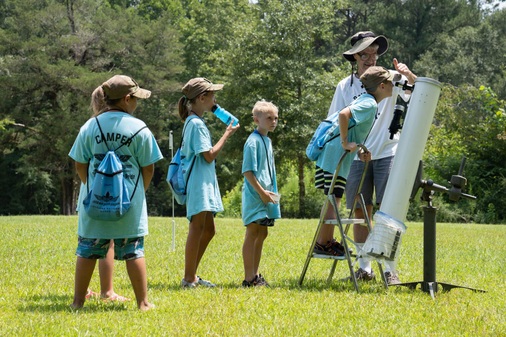 Children and siblings of Louisiana soldiers and airmen spend four days attending the fun, military-style summer camp, Camp Pelican Pride, at the Feliciana Retreat and Conference Center in Norwood, La., going through different tracks, such as marching, rock wall climbing, fishing and paddling, and resilience and disaster preparedness training, July 27, 2021. (U.S. Army National Guard photo by Staff Sgt. Josiah Pugh)